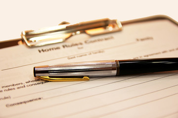 The form of the contract with a pen on a white background