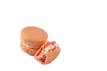 Smashed fresh pink macarons with soft cream inside, isolated