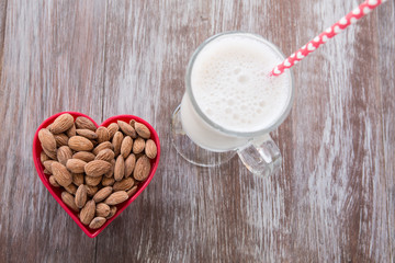 Almonds In Heart Shaped Bowl With Milk From Above