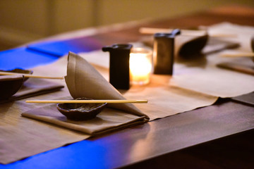 Naklejka na ściany i meble Table set by candlelight in a Japanese restaurant