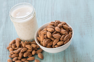 Bowl of Almonds With Glass of Almond Milk