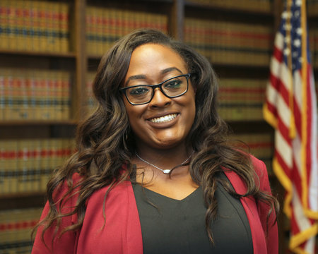 Portrait of an attractive African American professional woman, woman lawyer in law library