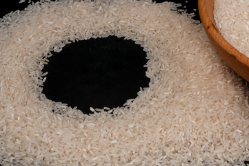 Closeup rice on black background empty space