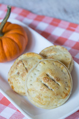 Apple Hand Pies and Pumpkin On Red Checkered Napkin