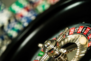 Poker Chips on a gaming table roulette Casino theme background