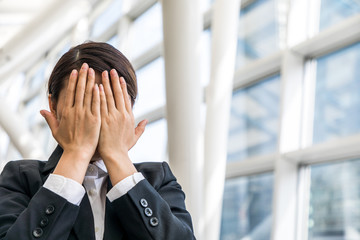 woman covering her face, business compliance concept