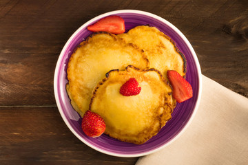 Freshly baked homemade pancakes with fresh fruit