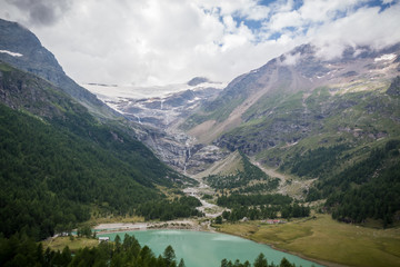 View on the Morteratsch glacier in St. Moritz with a lake in front