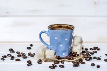 coffee cup with white sugar cubes. Unhealthy living concept 