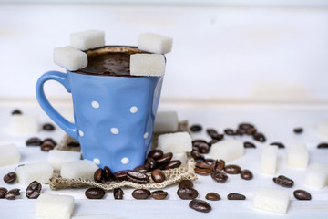 coffee cup with white sugar cubes. Unhealthy living concept 