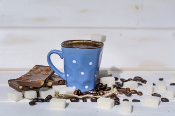 coffee cup with white sugar cubes and chocolate.Too much calories  concept 