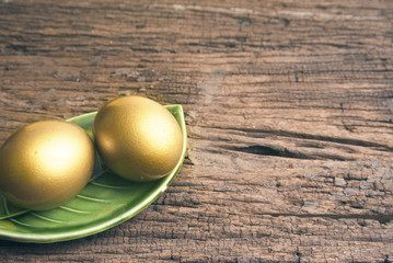 golden eggs and wood texture
