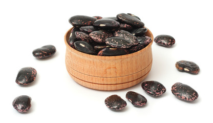 kidney beans on wood plate isolated on white background