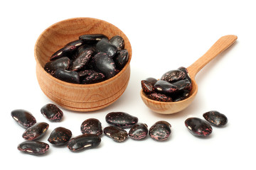 kidney beans on wood plate isolated on white background