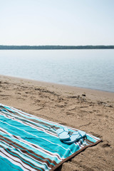 Beach Lake Michigan with Blue Beach Towel and Flip Flops