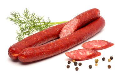 sliced red salami isolated on white background