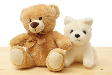 toy teddy on wood background