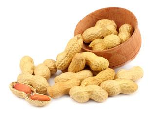 peanuts in wood plate isolated on the white background