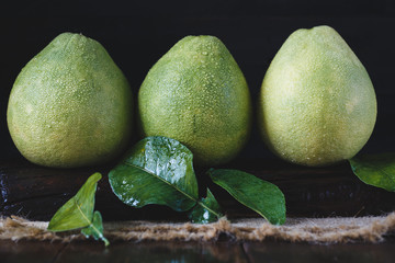 Green Pomelos on the old wood
