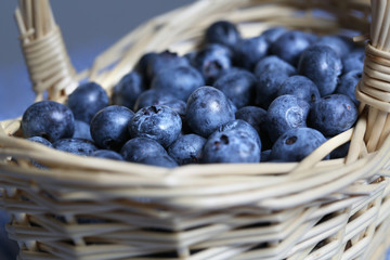 Fresh blueberries piled in wicker basket