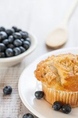 Blueberry Muffin with Blueberries and Wooden Spoon