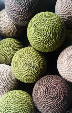 A collection of natural rattan woven balls