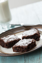 a Plate of Brownies With a Glass of Milk