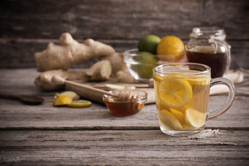  Ginger tea and ingredients on a  grunge wooden background