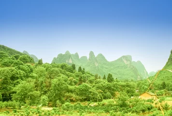 Gordijnen View on green karst landscape by Yangshuo in China © streetflash
