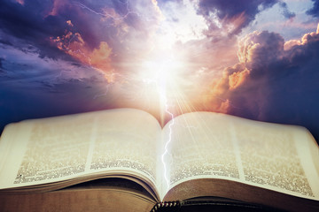 Dramatic sky with open Bible - 142724596