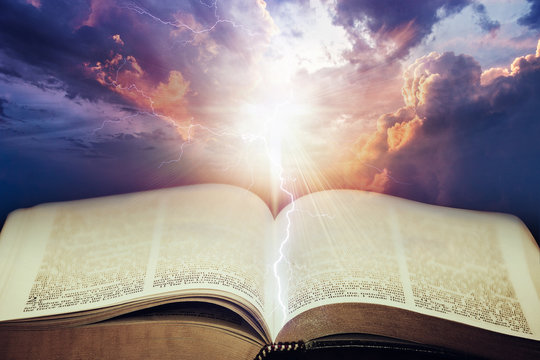 Dramatic sky with open Bible