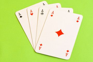 Play cards isolated on green background.