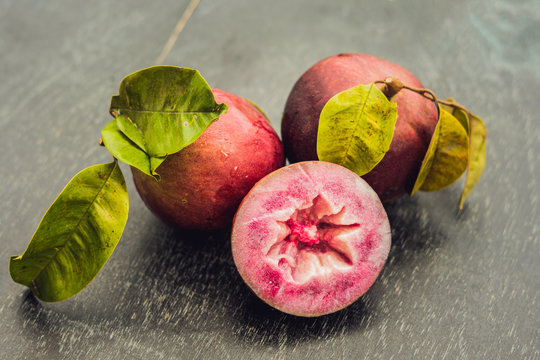 fresh Chrysophyllum cainito fruits on wood background