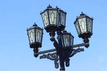 Fototapeta na wymiar Vintage lamppost on blue sky background