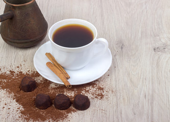 Dessert cocoa truffle, cinnamon and a cup of coffee