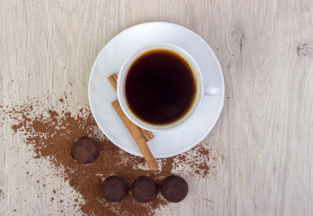 Dessert cocoa truffle, cinnamon and a cup of coffee