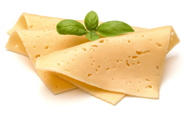 cheese slices and basil herb leaves isolated on white background cutout