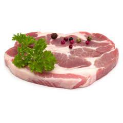 Raw pork neck chop meat with parsley herb leaves and peppercorn spices garnish isolated on white background cutout