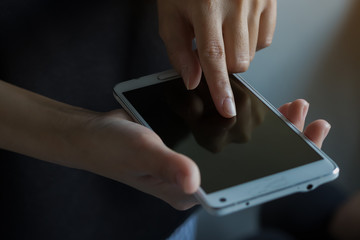 hand hold smartphone with light and shadow