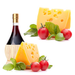 Red wine bottle, cheese and basil leave still life