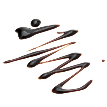 Fototapeta Balsamic vinegar cream isolated on white background. Italian salad dressing, sauce.