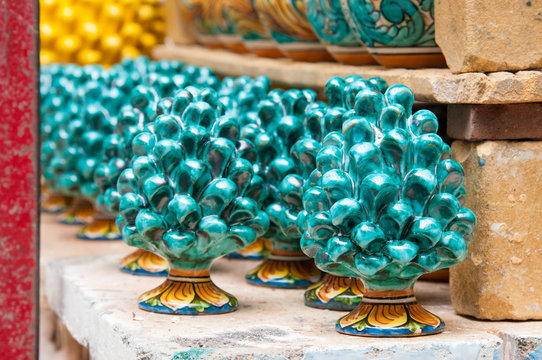 Colored pine cones in the workshop of a pottery artisan in Caltagirone, Sicily