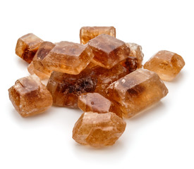 Brown caramelized lump cane sugar cube isolated on white background cutout