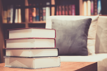 Book stack on the table in the living room.