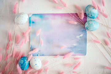 Easter mock up with fluffy flowers, eggs and watercolor abstract painting with space for text