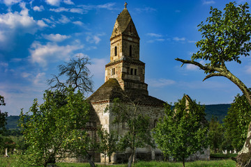 Fototapeta na wymiar Densus is one of the oldest church in Romania, built in VII century, rebuild in XVIII century with the stones from roman Sarmisegetuza