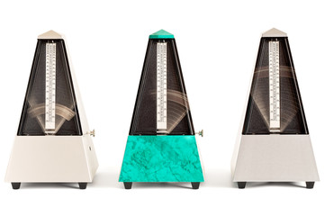 Three swinging pyramid shaped metronomes in plastic housing isolated on white