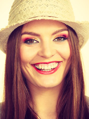 Happy flirty woman wearing sun hat