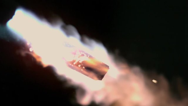 Flame from torch heating up piece of metal