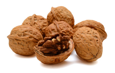 Cracked walnuts isolated on white background